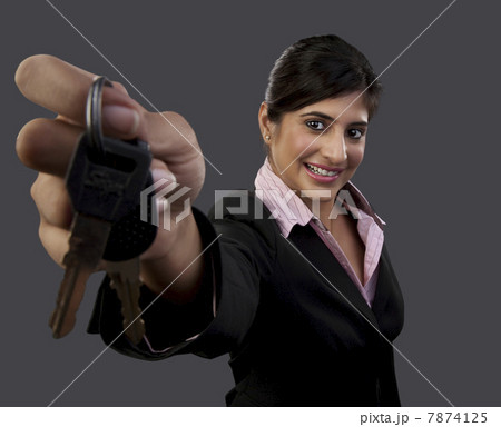 Woman holding a set of keys Woman holding a set of keys 7874125