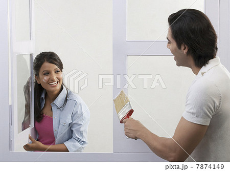 Couple having fun with paint  7874149