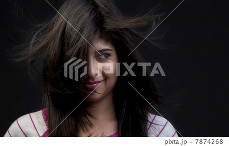 Hair covering half of a woman's face Hair covering half of a woman's face 7874268