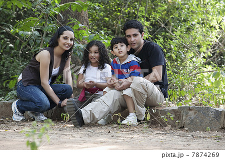Portrait of a family in a park Portrait of a family in a park 7874269