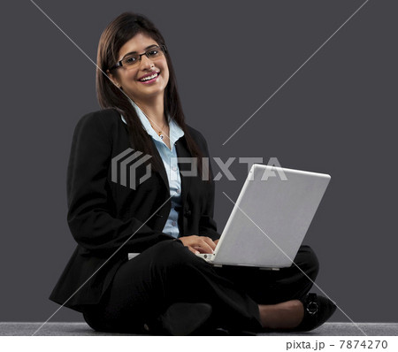 Businesswoman with a laptop Businesswoman with a laptop 7874270