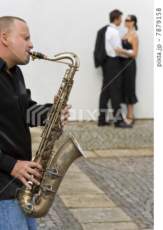 Romantic Couple & Jazz Saxophone Player Romantic Couple & Jazz Saxophone Player 7879158