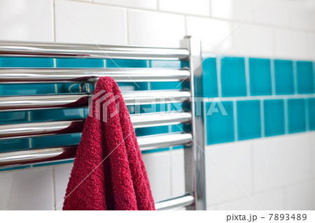 Towel hanging on a rail in bathroom 7893489