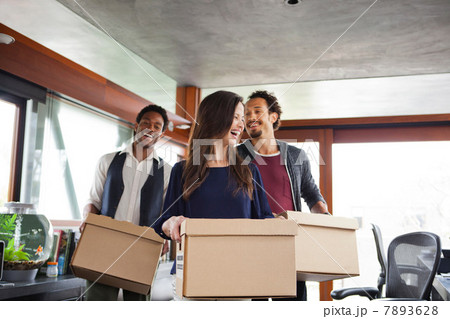 Business colleagues carrying cardboard boxes Business colleagues carrying cardboard boxes 7893628