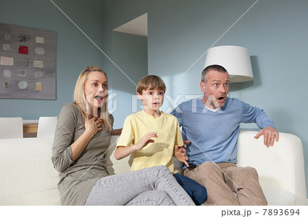 Family watching television Family watching television 7893694