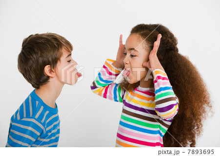 Children making faces at each other Children making faces at each other 7893695