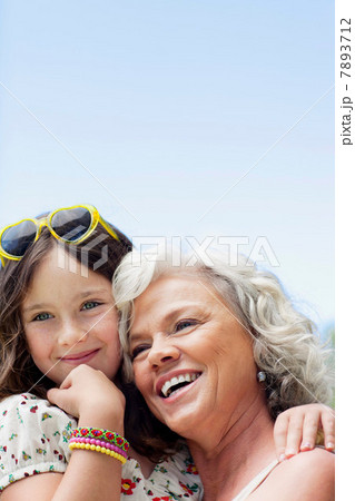 Grandmother and granddaughter hugging, portrait 7893712