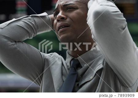 Stressed businessman at stock exchange 7893909