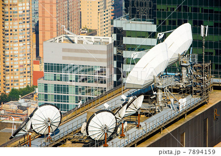 Satellite dishes and buildings in New York 7894159