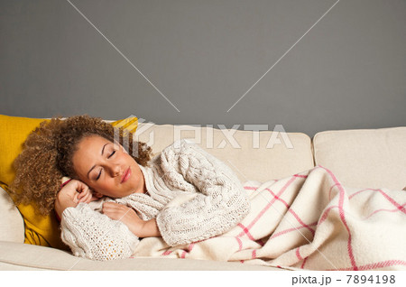 Woman asleep on sofa Woman asleep on sofa 7894198