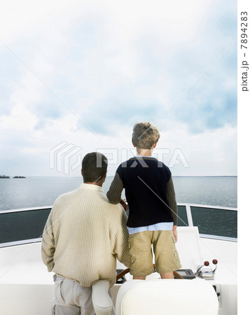 Father and son on boat 7894283