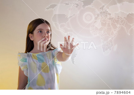 Girl touching virtual world map Girl touching virtual world map 7894604
