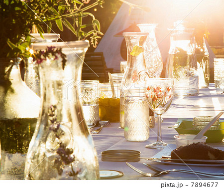 Water and herbs on set table outdoors Water and herbs on set table outdoors 7894677