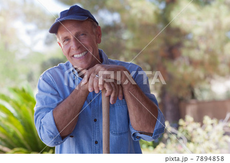 Older man gardening outdoors Older man gardening outdoors 7894858