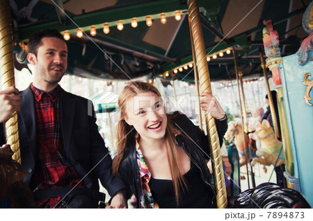 Young couple on carousel Young couple on carousel 7894873