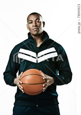 Basketball player holding ball, portrait Basketball player holding ball, portrait 7894923