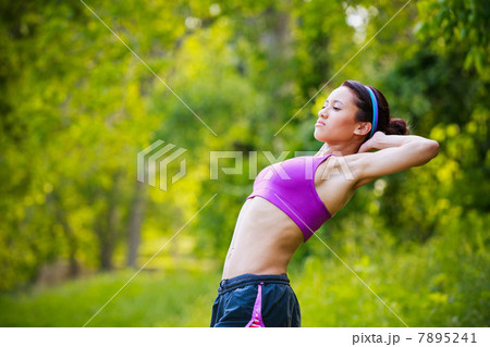 Young woman stretching Young woman stretching 7895241