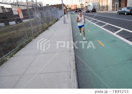 Male runner on urban street 7895253