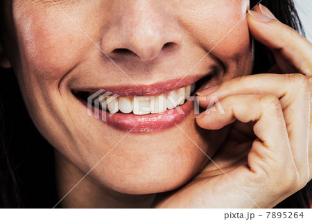 Mature woman touching cheek, cropped Mature woman touching cheek, cropped 7895264