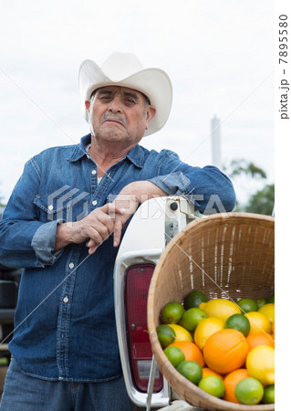 Farmer with produce in truck Farmer with produce in truck 7895580