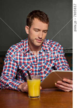 Young man with digital tablet 7895657