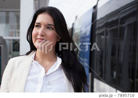 Young woman on train platform Young woman on train platform 7895710