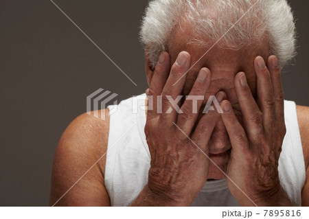 Senior man with head in hands Senior man with head in hands 7895816