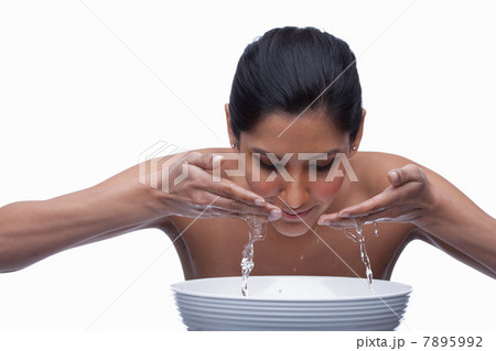 Young woman washing face Young woman washing face 7895992