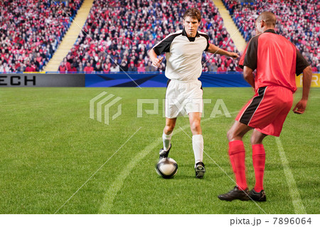 Football players kicking the ball Football players kicking the ball 7896064