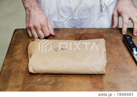 Butcher with package of ribs Butcher with package of ribs 7896085
