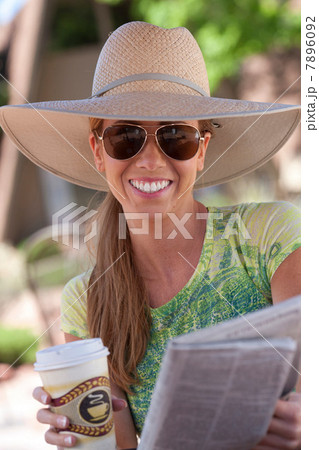 Woman having cup of coffee outdoors 7896092