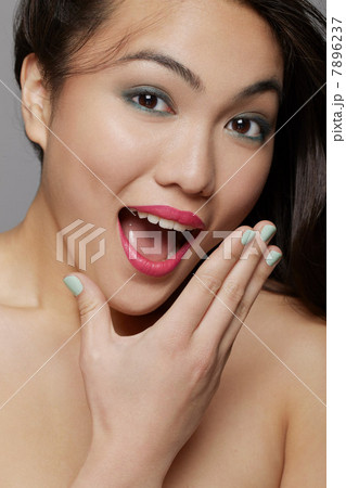 Portrait of young woman looking surprised in studio Portrait of young woman looking surprised in studio 7896237