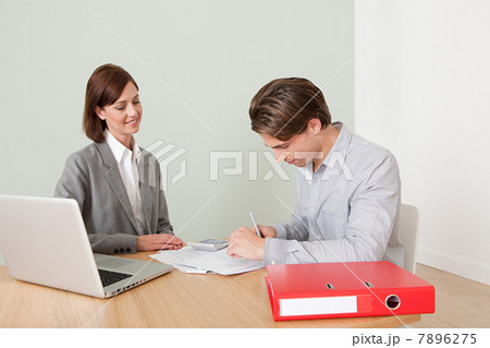 Young man with financial adviser 7896275