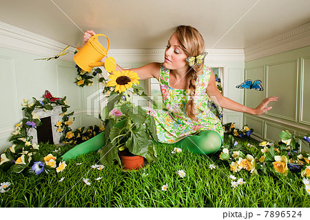 Young woman with garden in small room 7896524