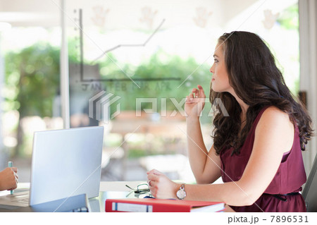 Businesswoman sitting in meeting Businesswoman sitting in meeting 7896531