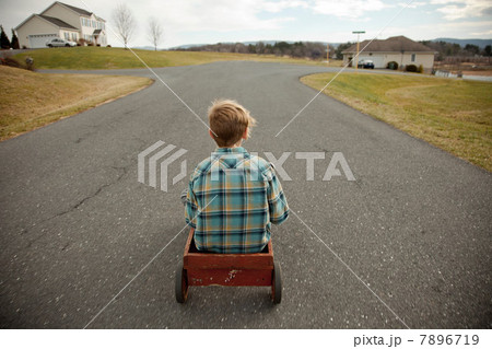 Boy riding go cart 7896719