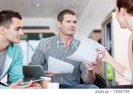 Man giving woman document Man giving woman document 7896796