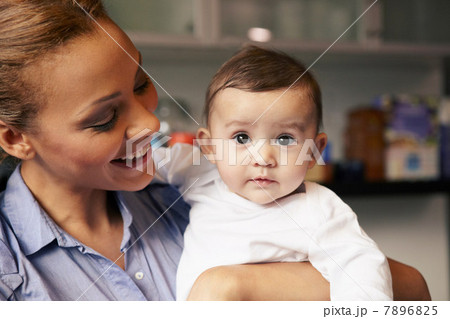 Mother holding baby girl Mother holding baby girl 7896825
