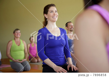 Mixed age group practicing yoga Mixed age group practicing yoga 7896858