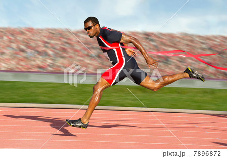 Runner crossing the finish line 7896872