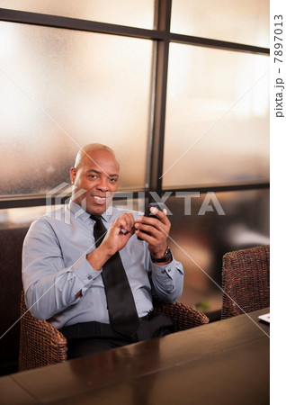 Mature man using cell phone Mature man using cell phone 7897013