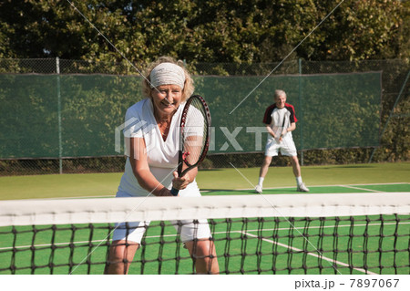 Senior and mature adults playing tennis 7897067