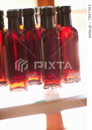 Close up of vinegar bottles on shelf Close up of vinegar bottles on shelf 7897363