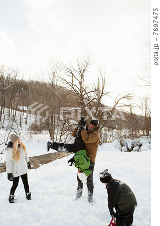 Family playing in snow 7897475