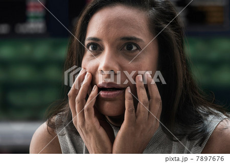 Shocked businesswoman at stock exchange 7897676