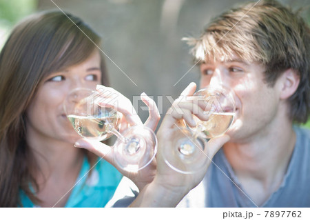 Couple drinking wine together outdoors Couple drinking wine together outdoors 7897762