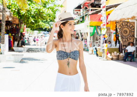 Young woman walking down street Young woman walking down street 7897892