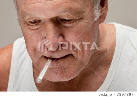 Senior man with thermometer in mouth 7897897