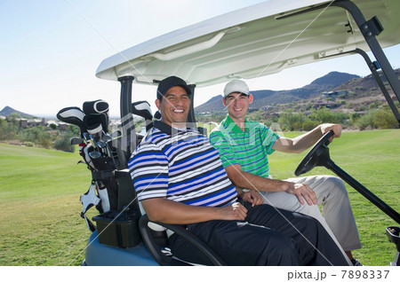 Portrait of two men in golf cart Portrait of two men in golf cart 7898337