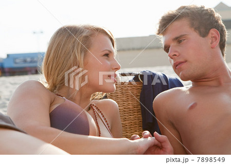Teenage couple at the beach 7898549